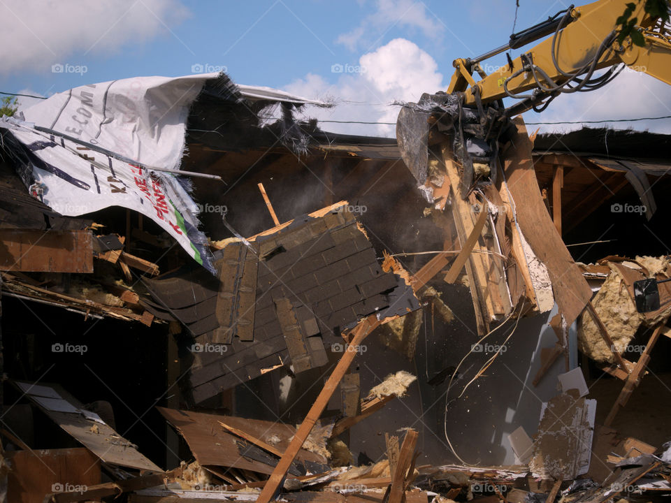 Tearing Down a Storm Damaged House with an Excavator