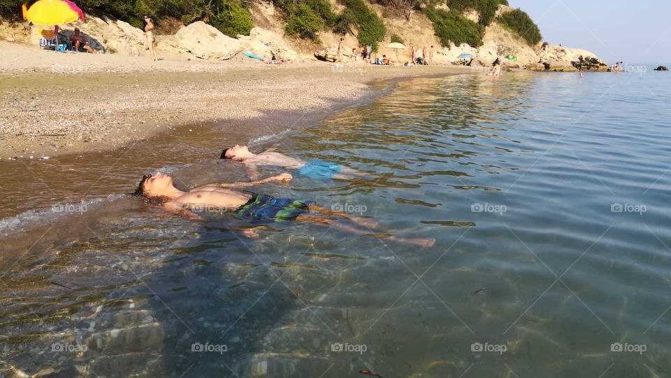 sunbathing on the beach in the see