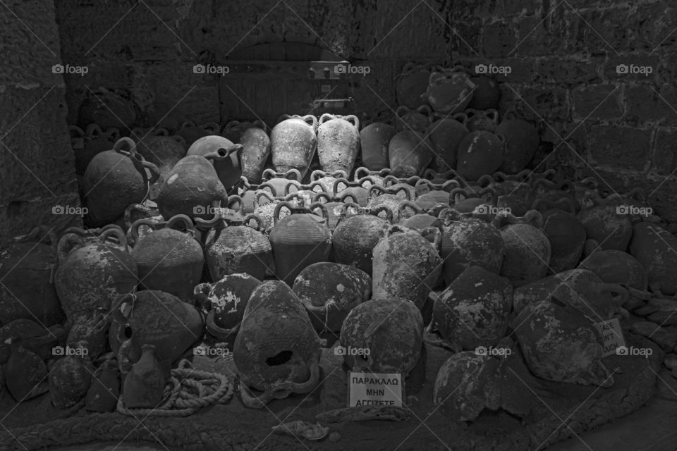 A light on the past. Amphorae recovered in the Cretan sea and illuminated by a beam of light that penetrates from the top of the Venetian fortress of Heraklion.