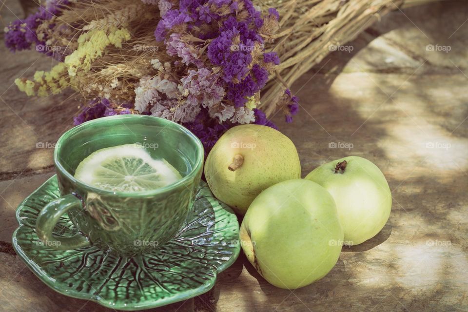 Vintage feel lemon tea, with fruit and dried flowers