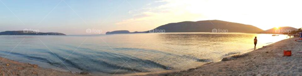 panoramic view of Capo Caccia, in the mediterranean sea, from an awesome sandy beach in Alghero