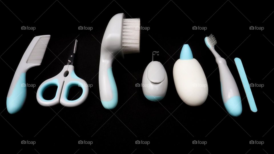 Baby care tools for everyday hygiene. Scissor,baby comb, hair brush, nail clipper, aspirator nasal, teeth brush, and nail care.