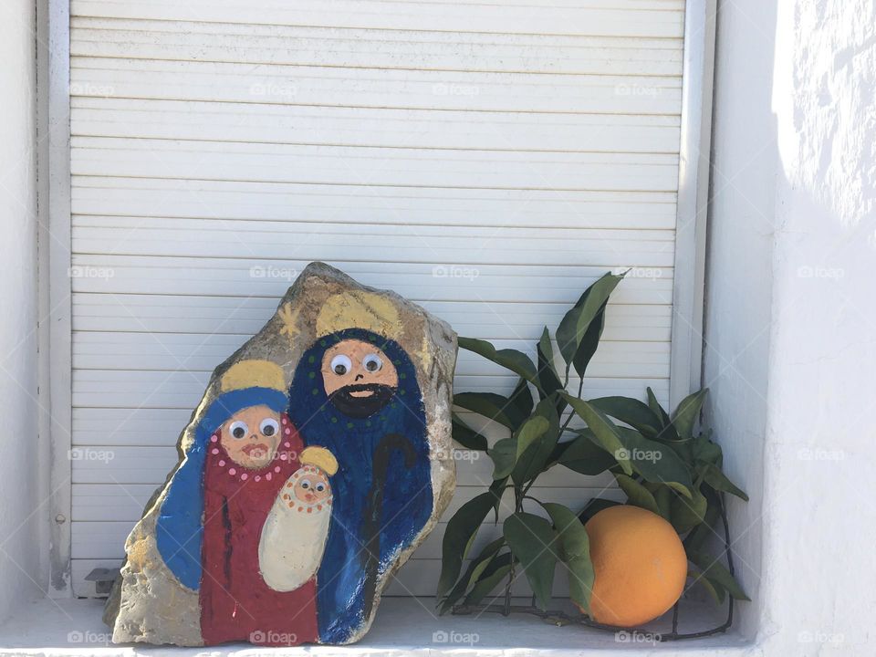 Simple Christmas decoration on the window with symbolic orange