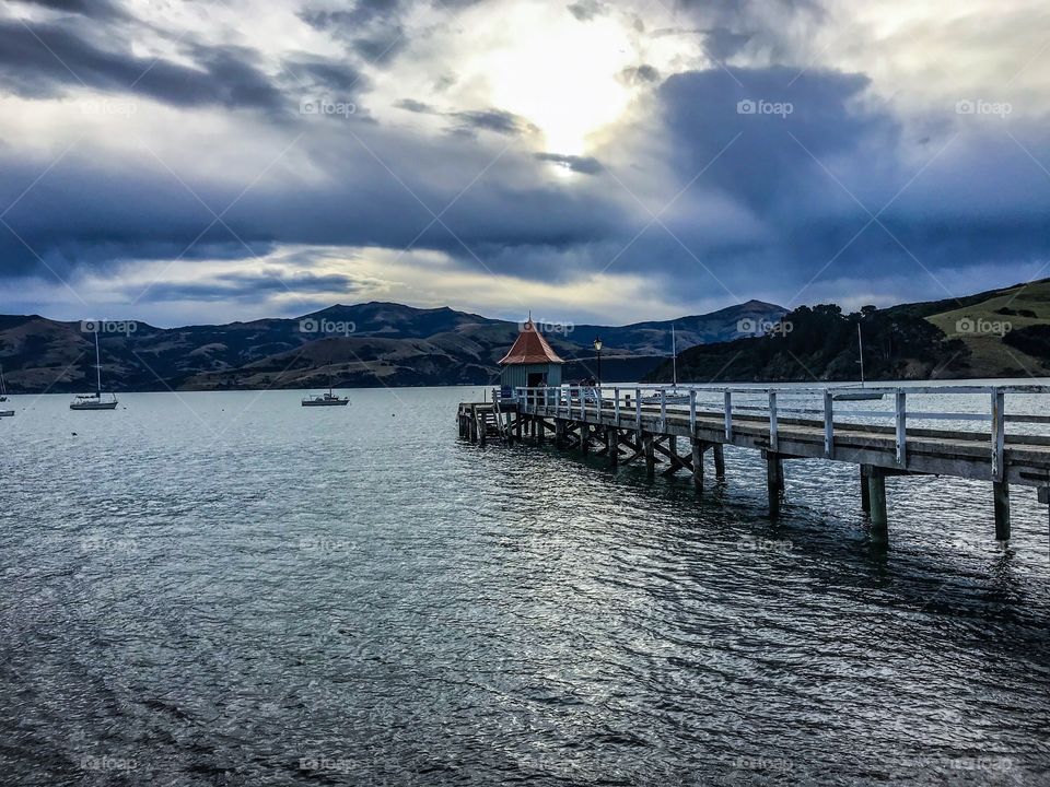 “Akaroa Harbour, New Zealand” Akaroa is a historic French and British settlement nestled in the heart of an ancient volcano. The landscape and its sparkling waters are home to a variety of sea life including dolphins,fur seals,penguins and bird life.