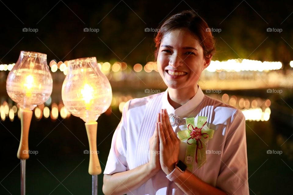 Pretty girl with candle light at night