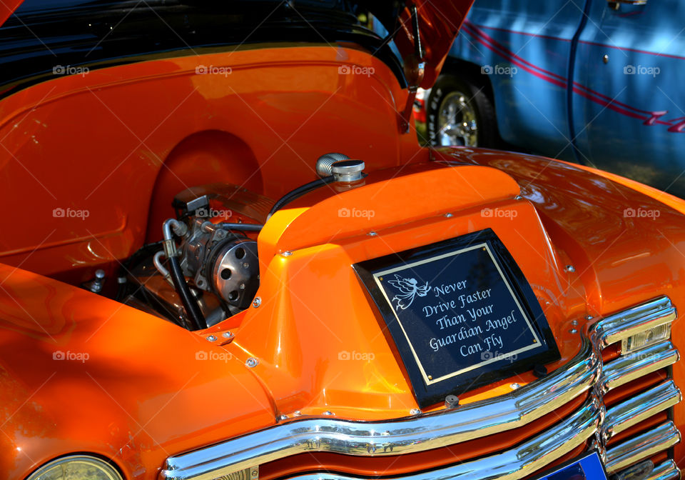 Classic car engine with a funny plaque