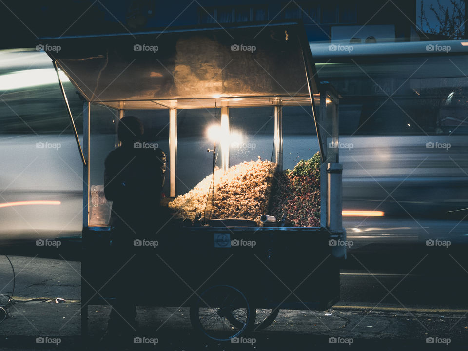 A popcorn seller on the streets  silhouette