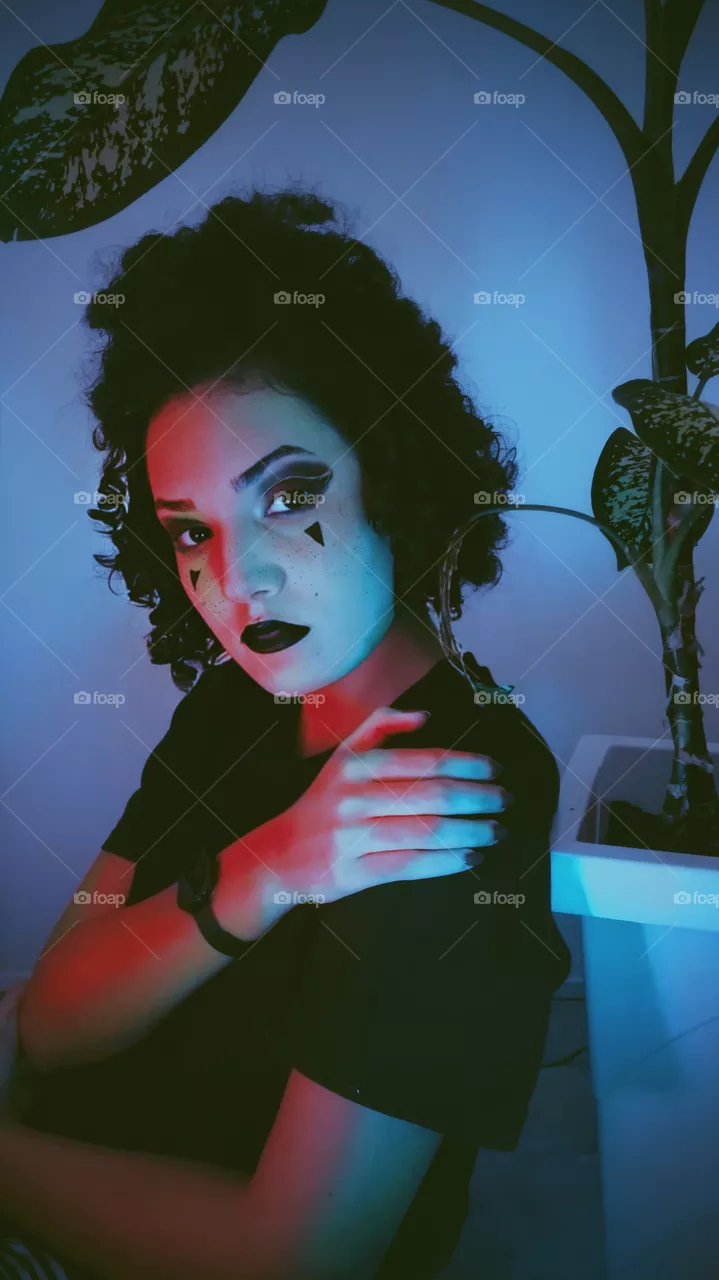 blue red lights girl with plant