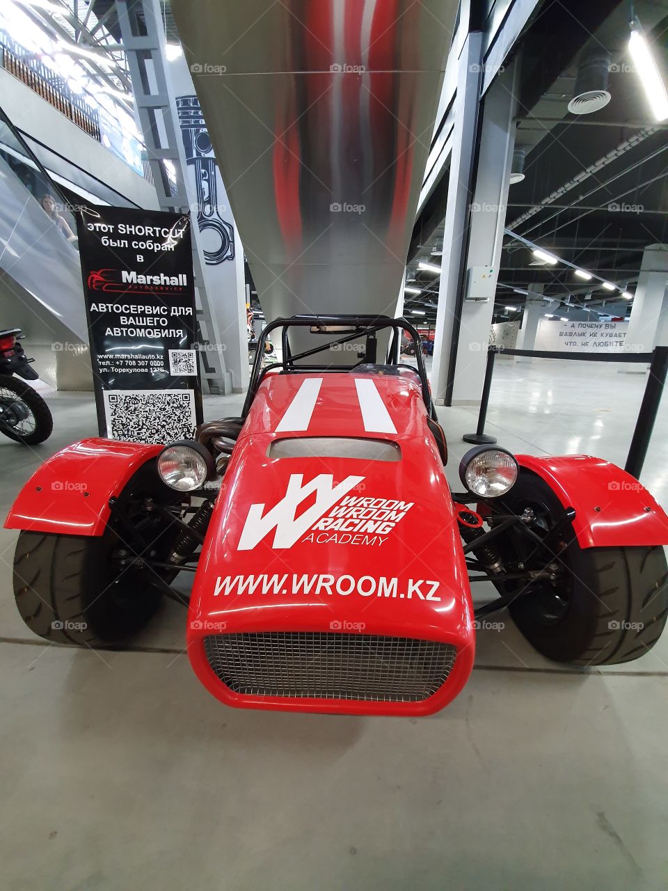 bright red racing car in exhibition