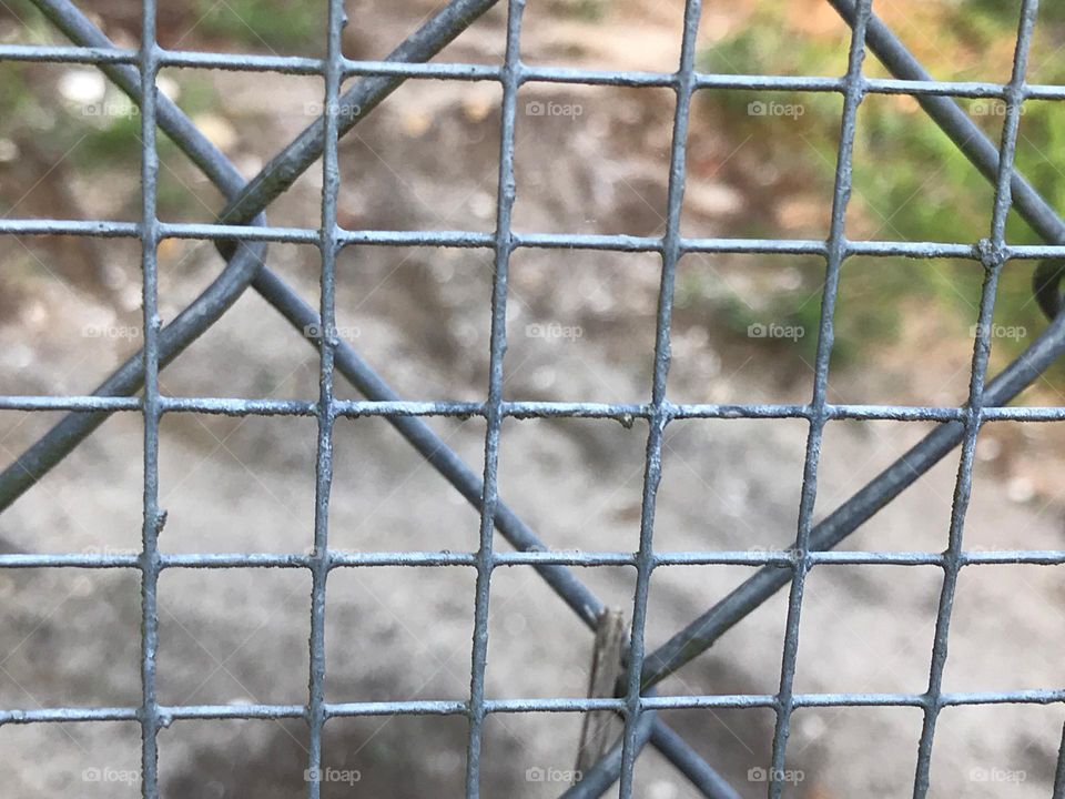 Wire fence with triangles.