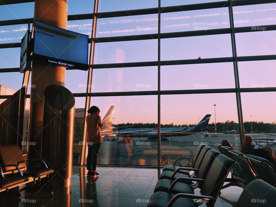 Girl waiting for a plane
