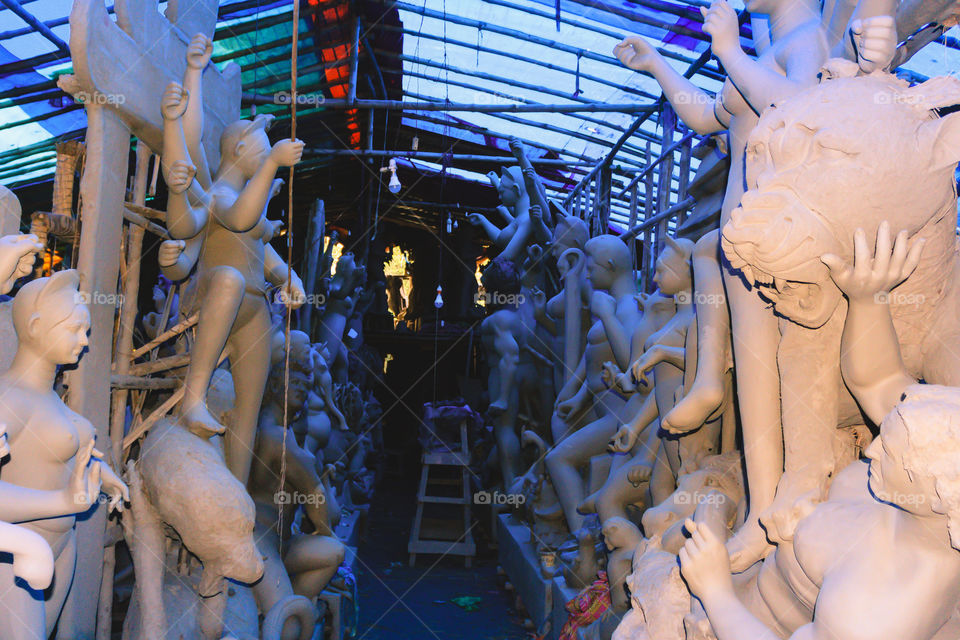 Handmade clay model of "Maa Durga" or " Devi Durga"- Hindu woman Idol close up. Snapped in the beginning of city famous Bengali festival of Kolkata or Calcutta, West Bengal, India, Asia