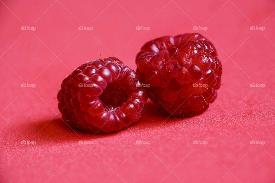 Macro of two red raspberries