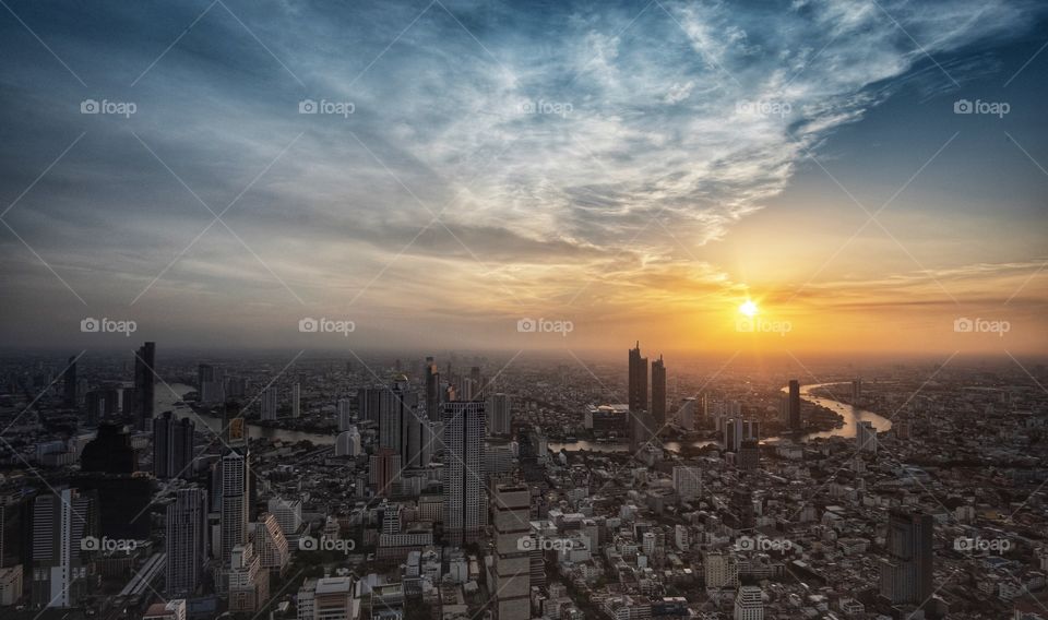 Beautiful sunset scene over capital city scape in Summer , Bangkok Thailand