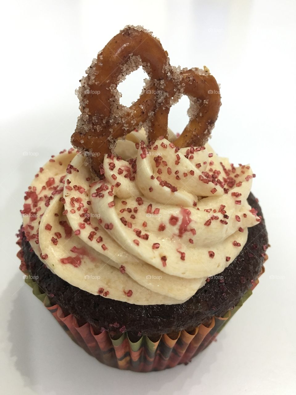 Milk Chocolate Cupcake with Caramel Buttercream with Cinnamon Sugar Pretzel 