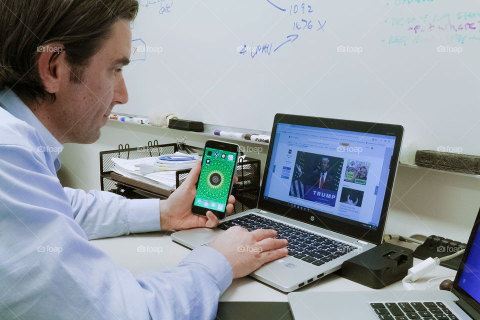 At work browsing the Internet on my laptop and on my mobile device