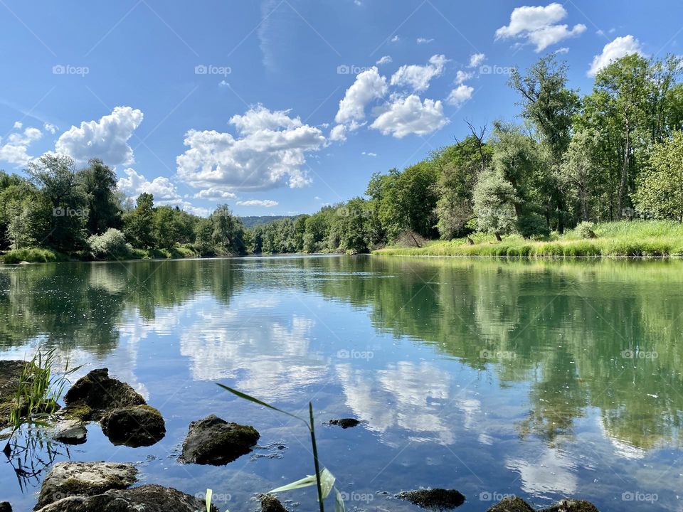 water landscape grass and clouds