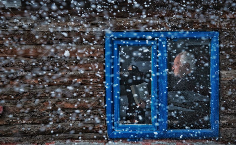 Man reading book in winter