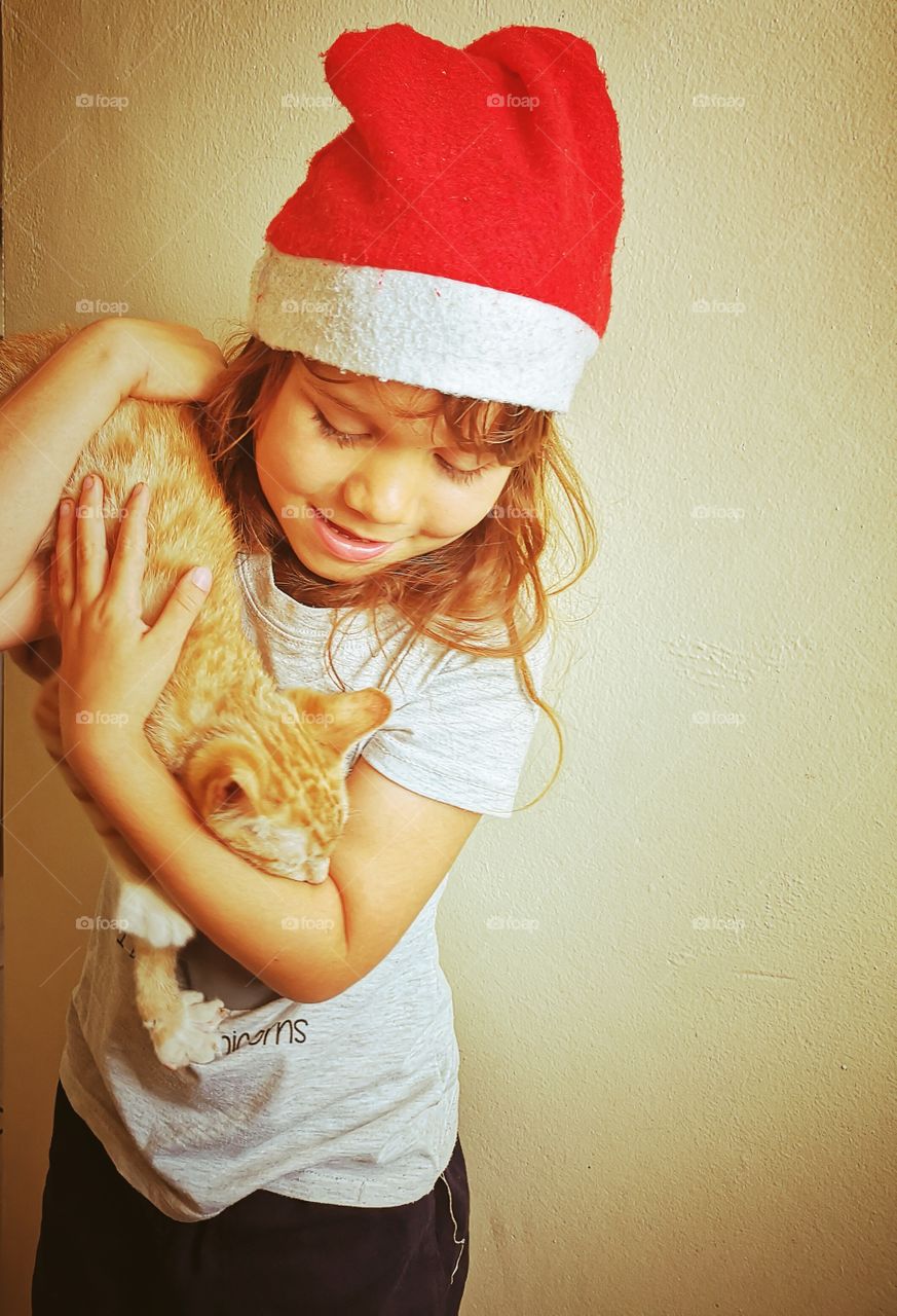 Girl with ginger cat at Christmas
