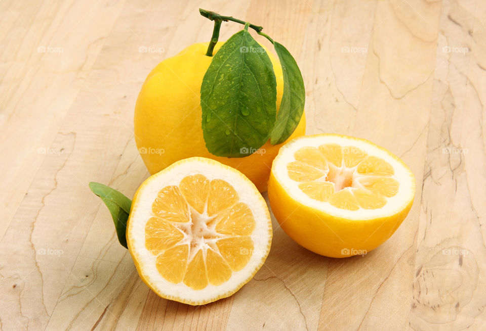 Lemons on the wooden surface 