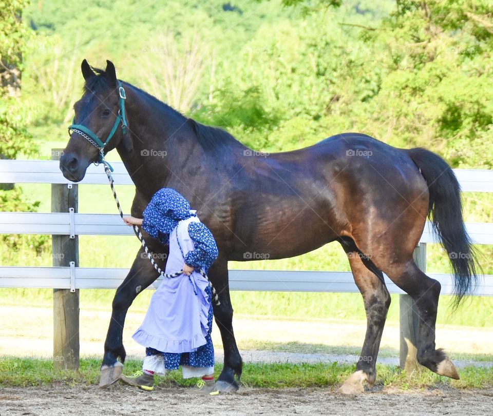 Little girl with her horse 