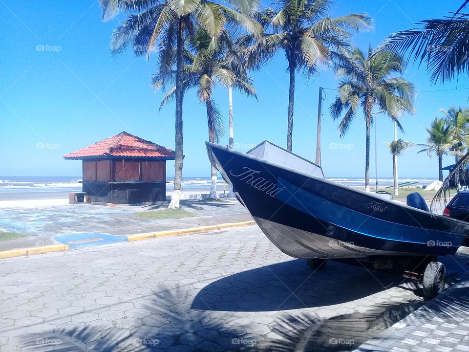 Thaina boat. Beautiful autumn day . Blue sky. Near beach.