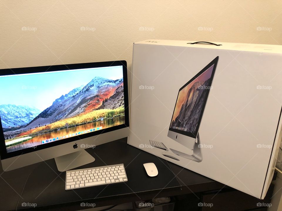 27 inch Apple iMac on desk with box 