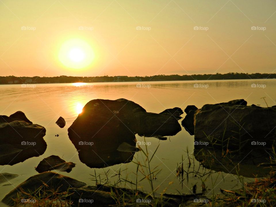 Early morning sunrise reflecting off the bays surface. 