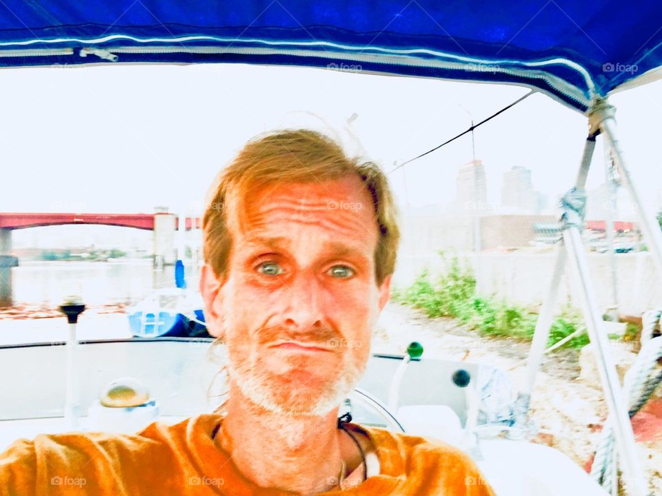“Timothy Trespas”, my significant other for so many years I almost lost count is enjoying a warm summer day on the fly bridge of the “Salvation”, our “28 ft 1969 Luhrs” cabin cruiser. 2019. Hypnotic Productions