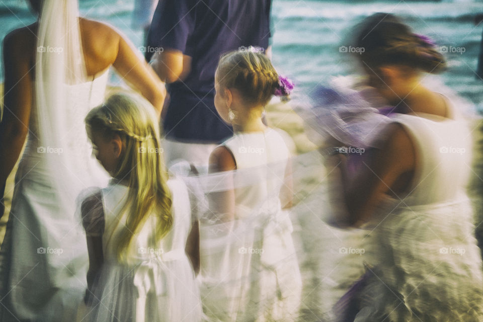 beach wedding. cute little girl