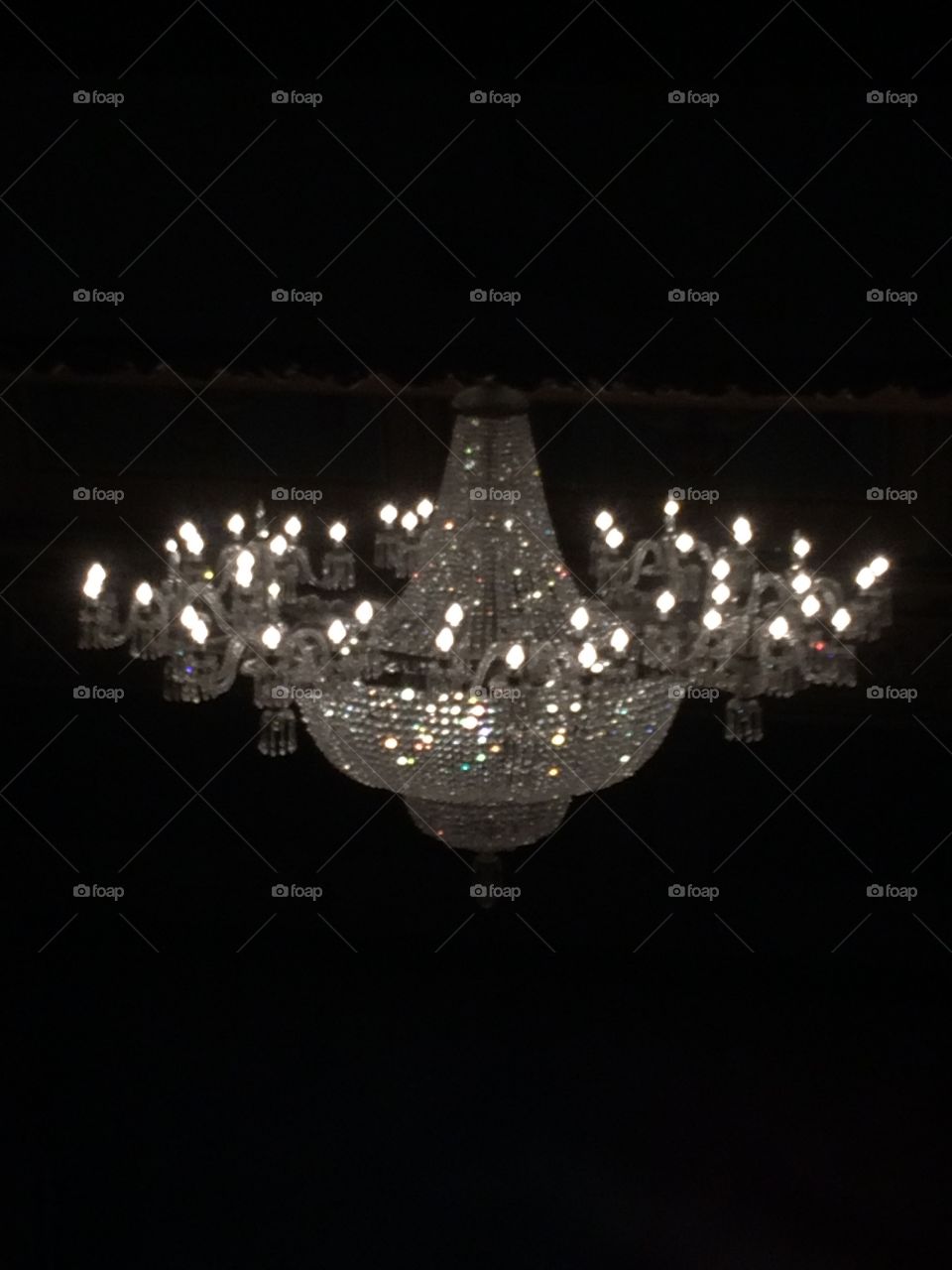 Gorgeous chandelier in the Queens Theatre London. Very ornate and huge how does it stay up. 