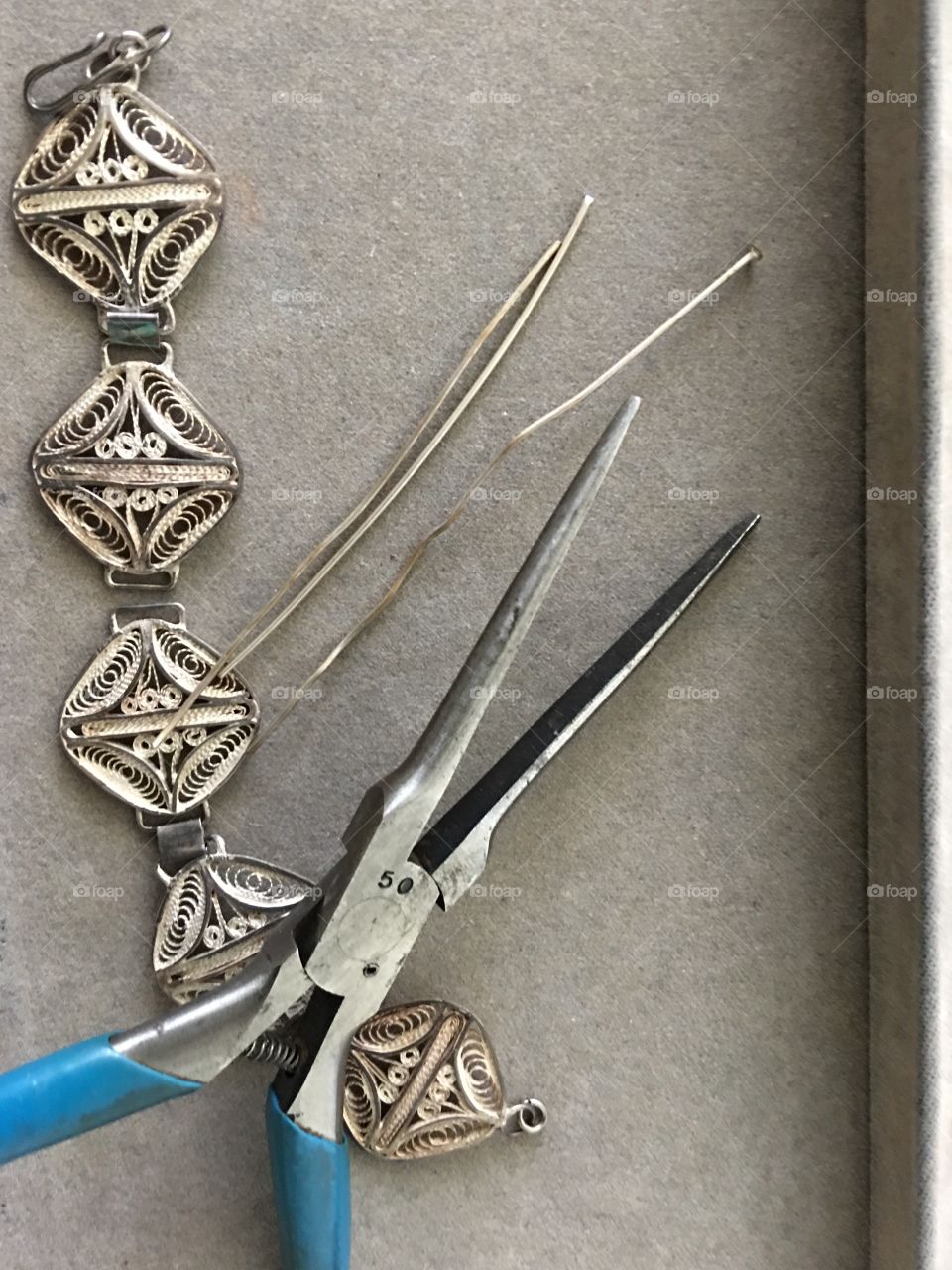 Close up pliers with wire jewelry 