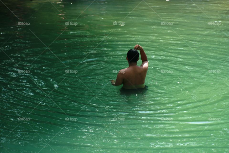 swimming in wild river