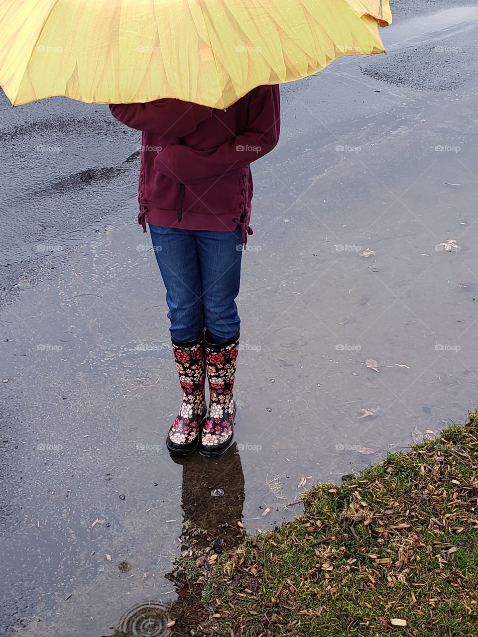 Rain boots in a puddle
