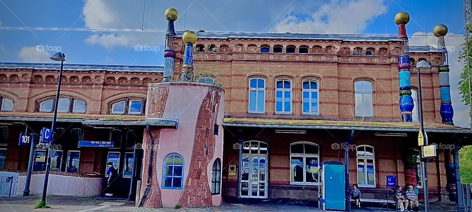 The “Bad Ülster” train station in “Saxony”, Germany.” features adjacent buildings painted rosé and a peach parfait. Together they exude a feeling of warmth and the traditional shapes and decor of the buildings add to this effect.2022. Hypnotic Prod