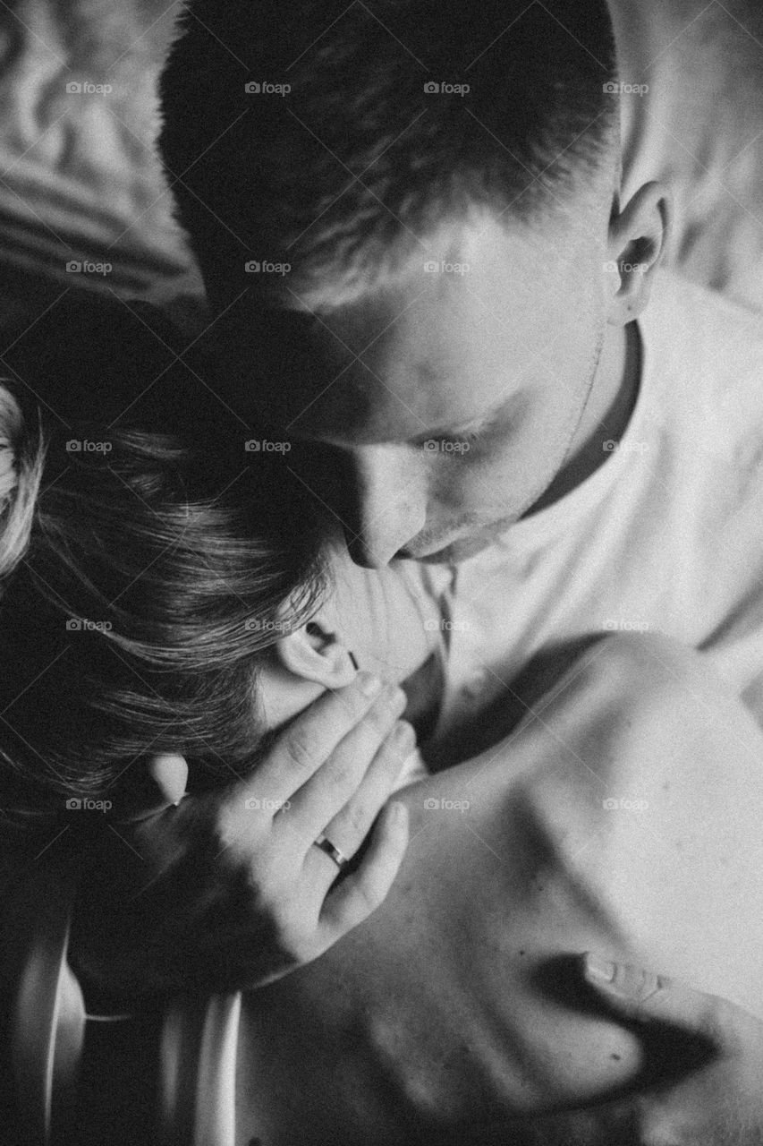 Groom hug bride. Black and white photo