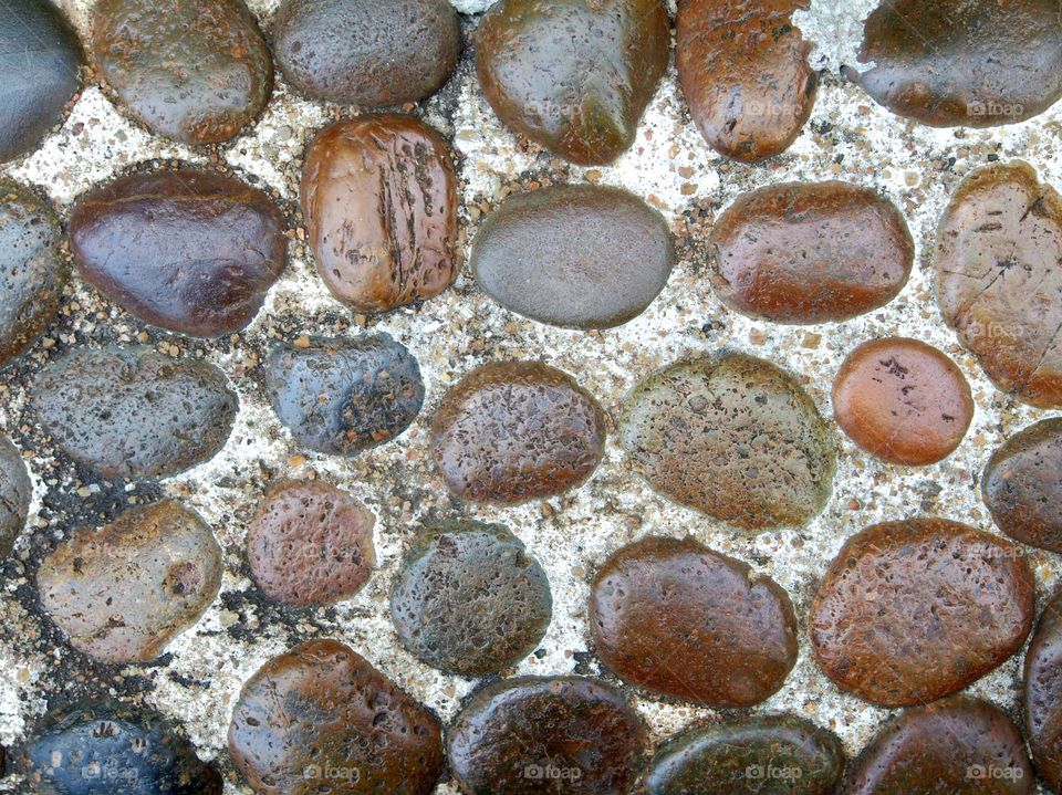 Stone wall background with rocks of different sizes