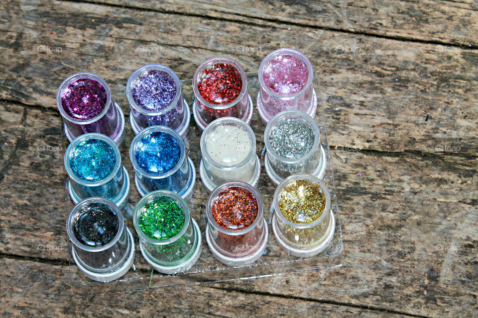 Colorful glitters in bottles