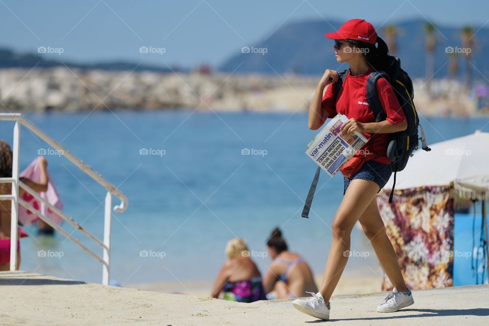 young beautiful girl tourist is walking along the promenade of France