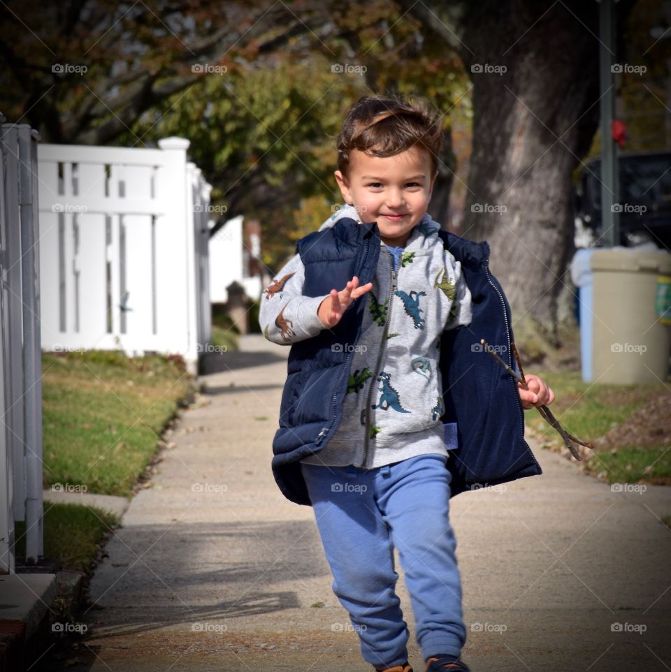 Portrait of a smiling boy running