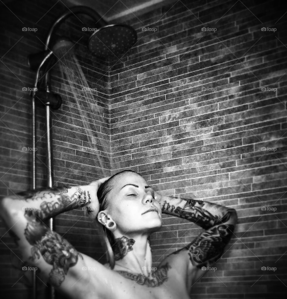Young woman taking shower