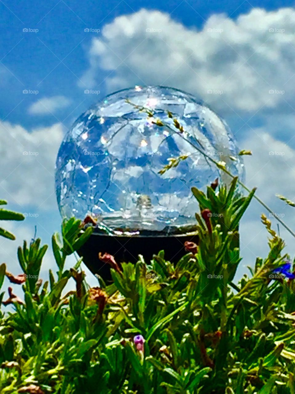 Blues skies and clouds as seen through a solar ball. 