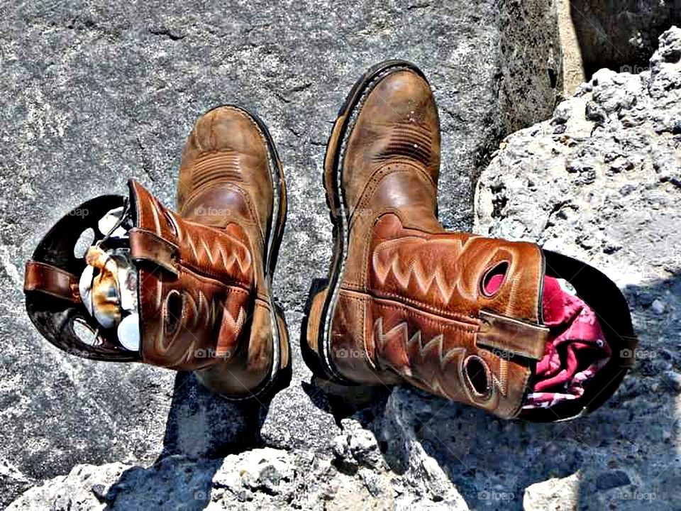 When you don't have a bucket to hold seashells use your boots!