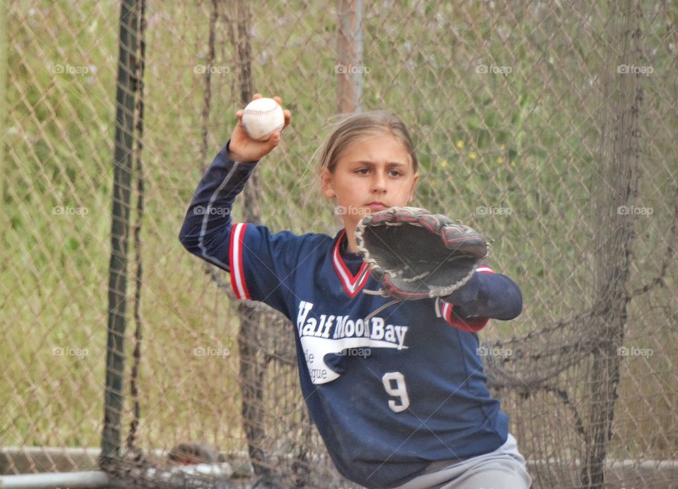 Female Baseball Star. Athletic Young Woman Playing Baseball Shows What It Really Means To Throw Like A Girl
