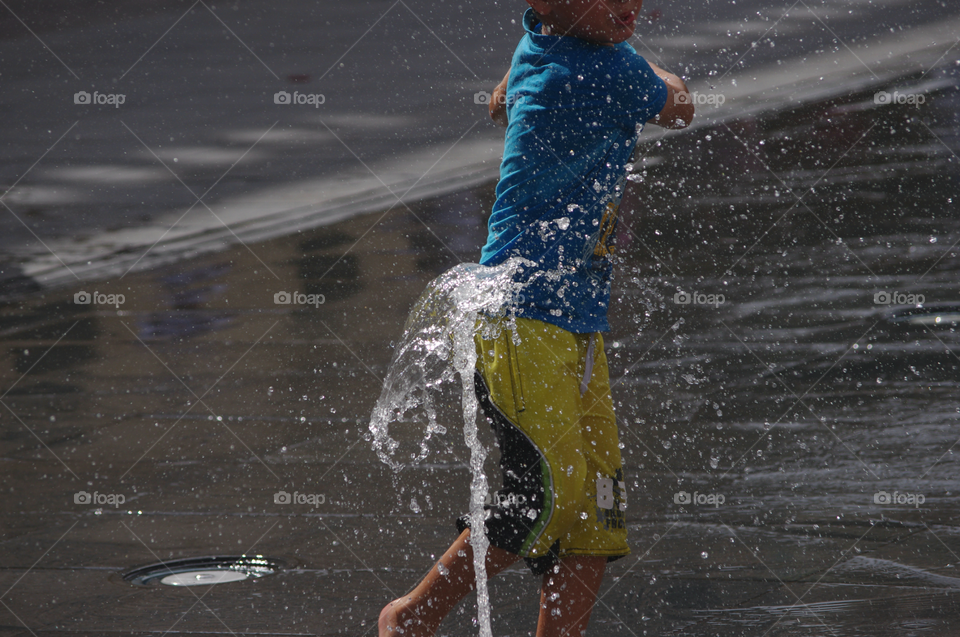 Boy playing in water