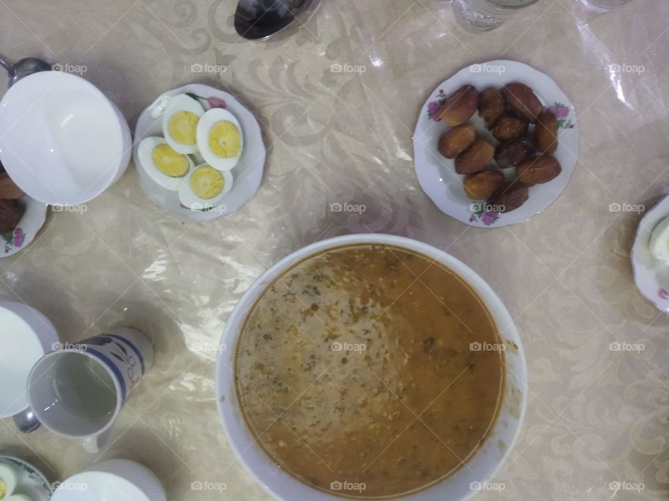 Moroccan table in Ramadan month:  Soup. Date and eggs.