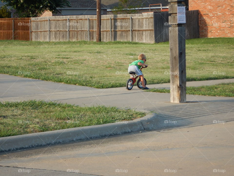 Little man and his bicycle. First bicycle
