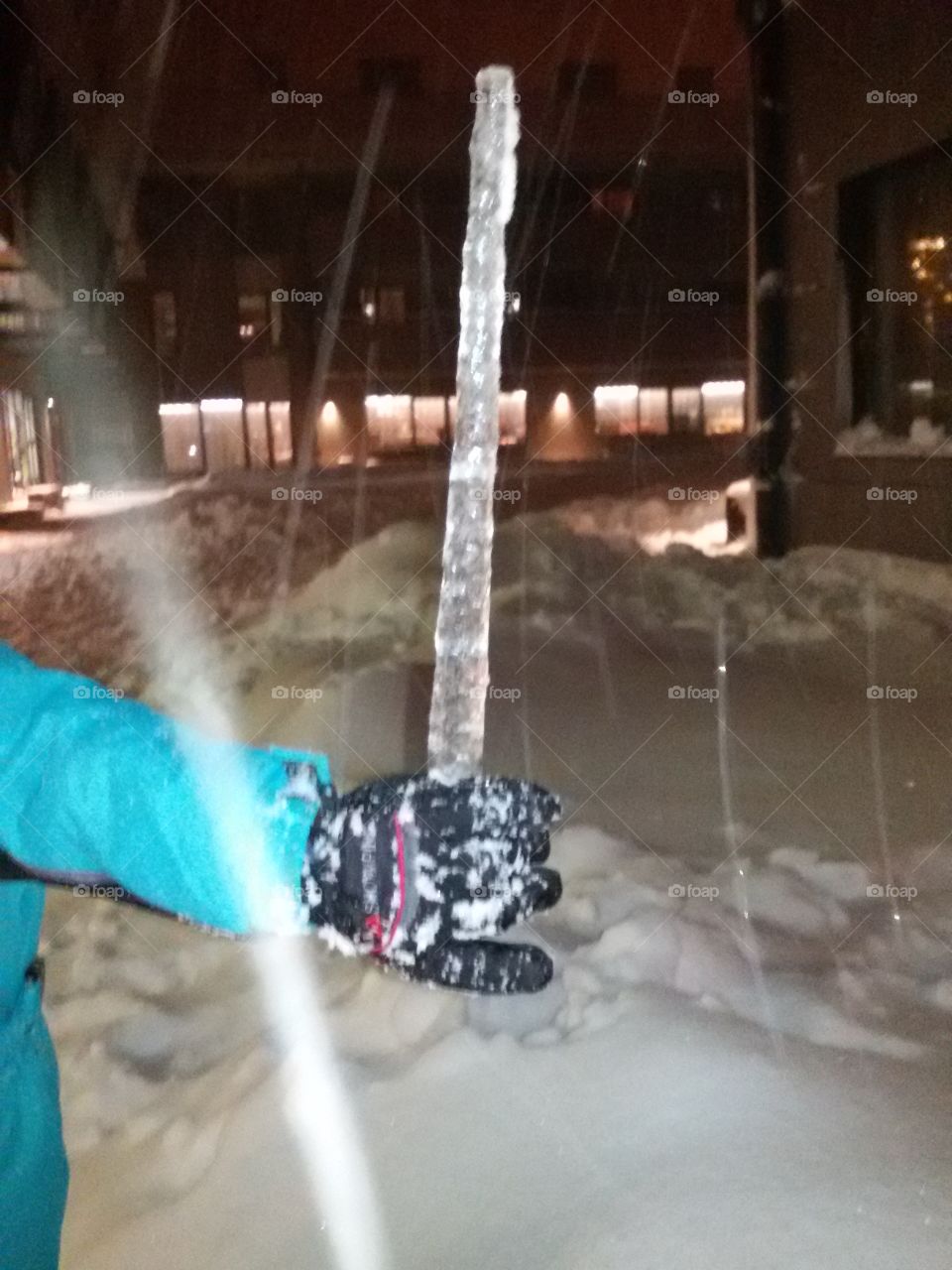 icicle in kid hand winter time