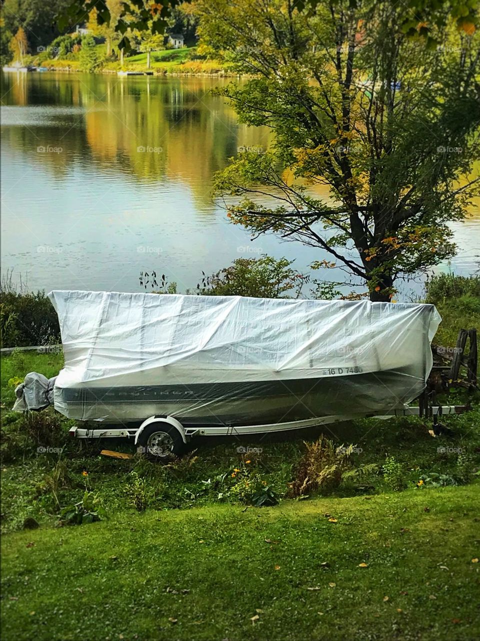 Covered motor boat at lakeside