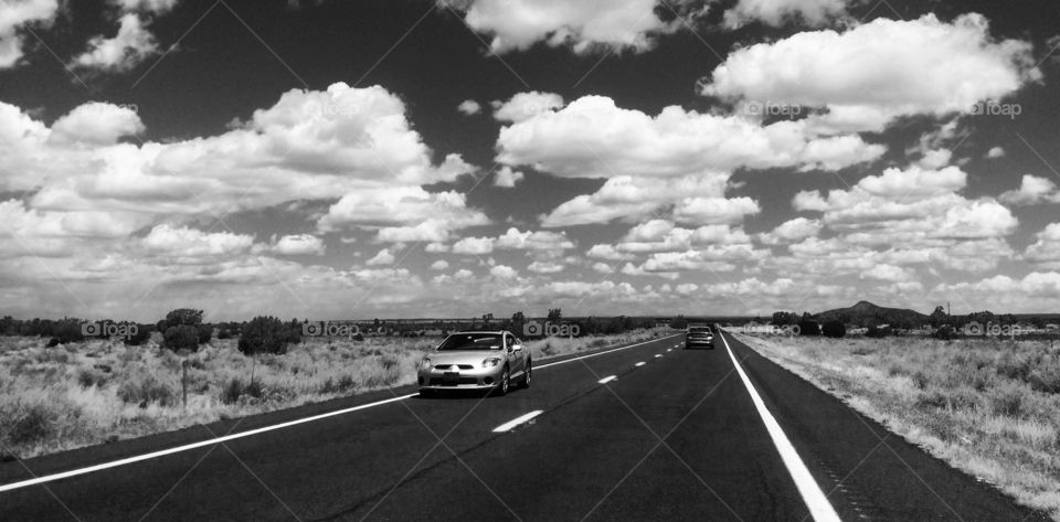 The open road in Black & White. Driving through Arizona on a cloudy day